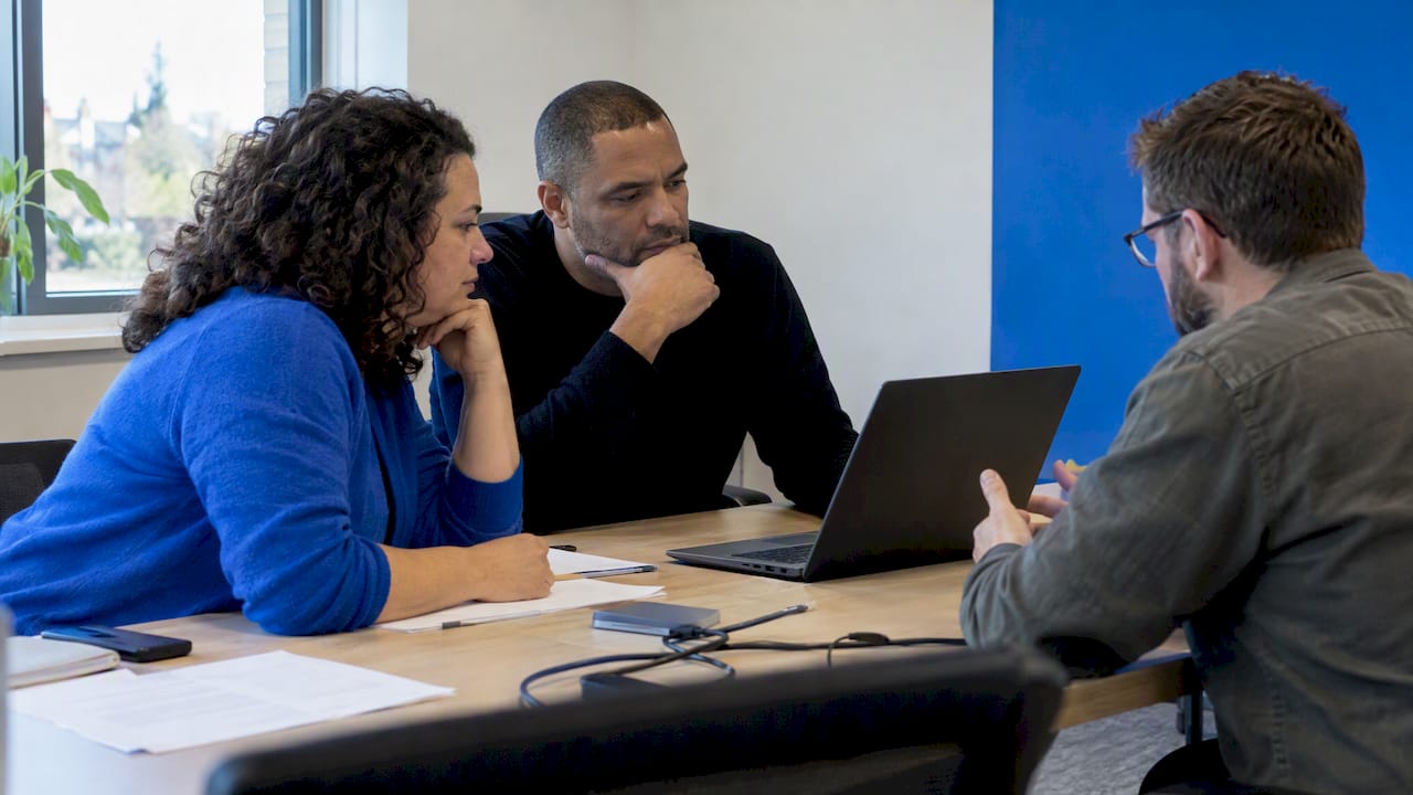 Managers comparing communication pilot options