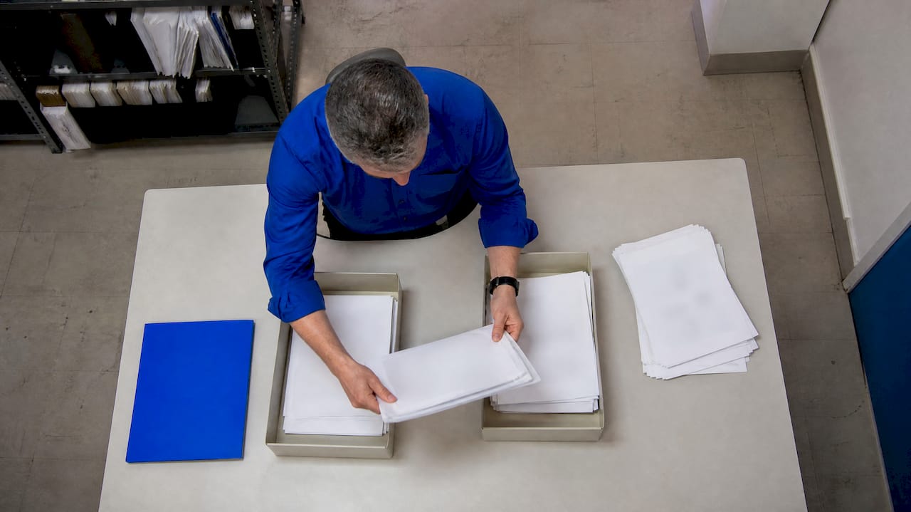 Analyst sorting duplicate CRM records